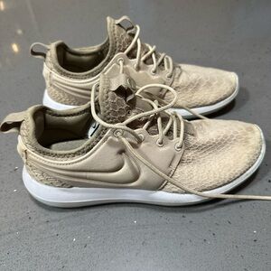 Beige Nike Size 8 women’s shoes. Great condition. Haven’t worn too many times!